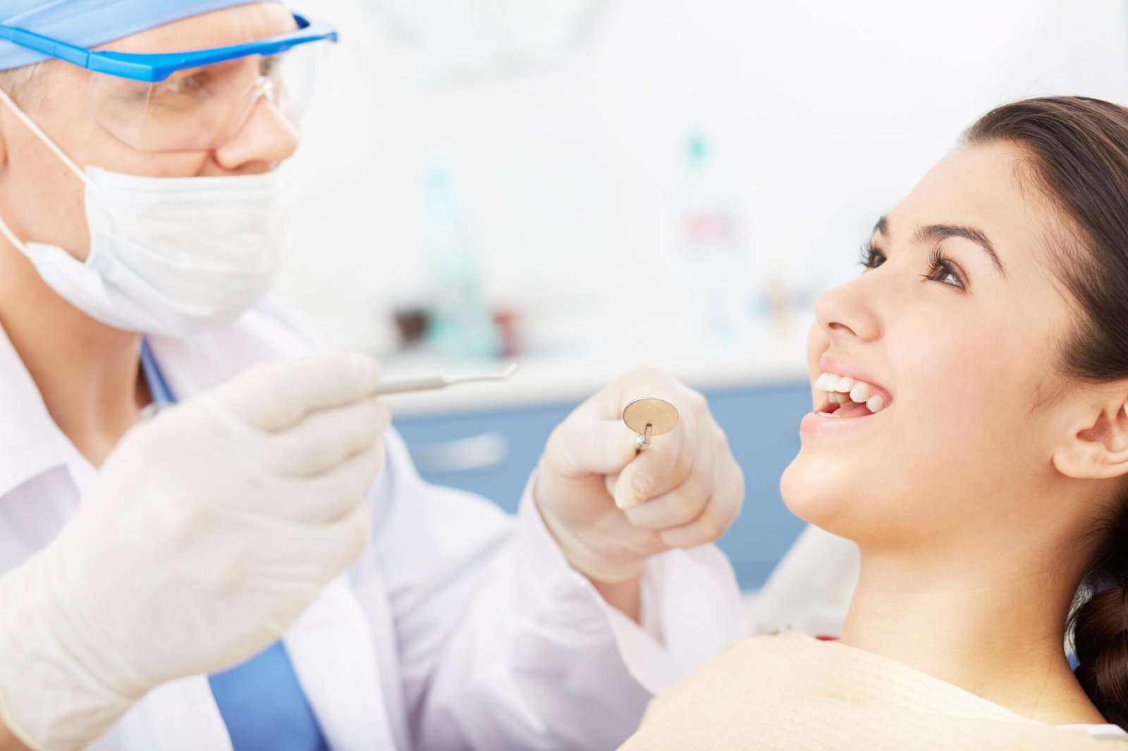 Young girl with open mouth before oral checkup at the dentists